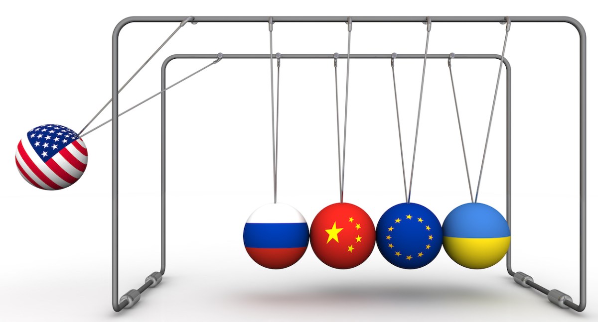 the global impact of the war in ukraine | balls painted like national flags colliding in a newton's cradle