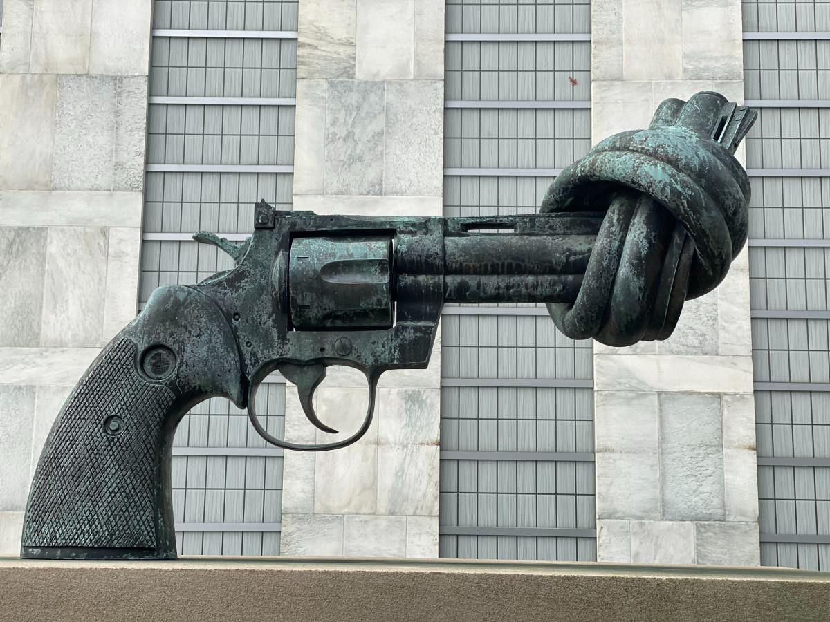 Mass shootings in America: Why does the U.S. continue to do nothing? | Gun with knot statue