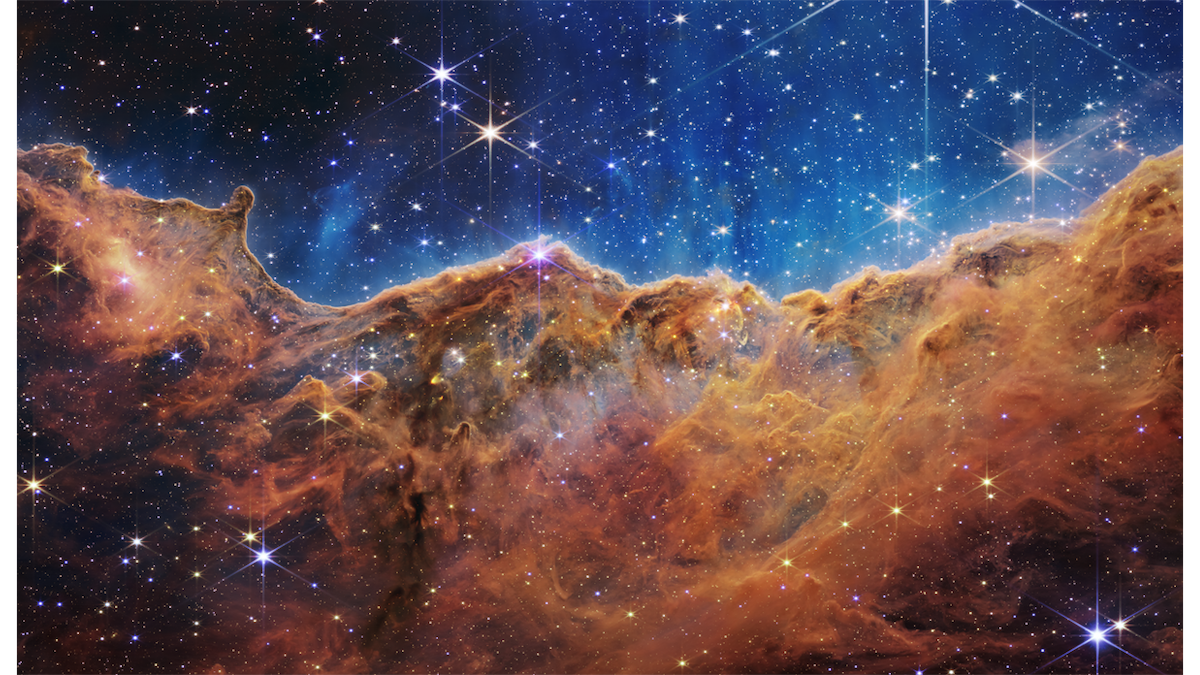 NASA's Webb Telescope peers deep into the early universe | The "cosmic cliffs" of the Carina Nebula in a Webb image released Tuesday.