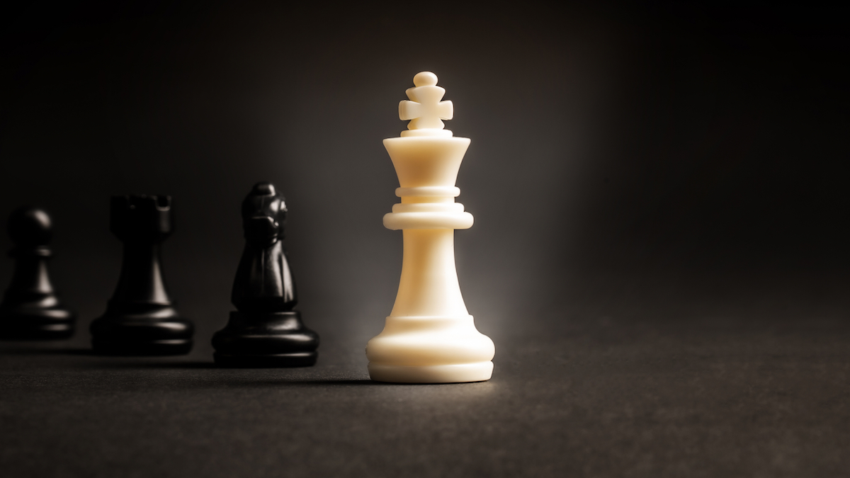 white king black pawns chess board