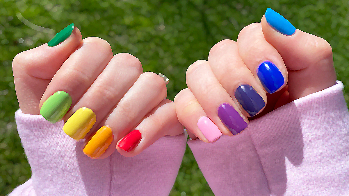 My favorite contradiction: nail polish and femininity, feminism, and men’s liberation | Rebekah's nails in a rainbow skittle manicure